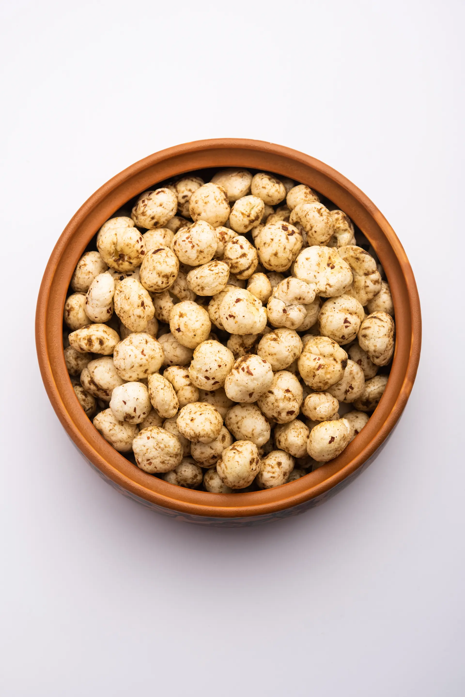 Roasted makhana in a clay bowl